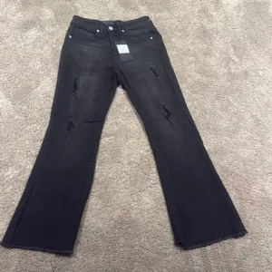 Black Flare Wide Leg Jeans with Distressing super stretchy risen brand